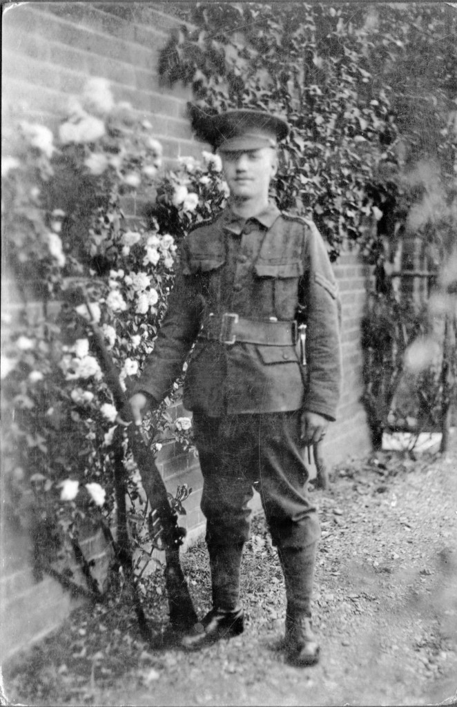 This picture, almost certainly Corporal Arthur, taken in a walled garden is adjacent to the picture of an older lady with toddler in the same walled garden